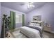 Relaxing bedroom with a plant, modern decor, and a large window at 4324 Auston Way, Palm Harbor, FL 34685