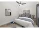 Comfortable bedroom with a large window, modern furnishings, and stylish decor at 4324 Auston Way, Palm Harbor, FL 34685