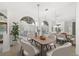 Dining area with a large window, modern lighting, and dining table at 4324 Auston Way, Palm Harbor, FL 34685