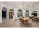 Dining room with large windows, and an oversized mirror across from the table at 4324 Auston Way, Palm Harbor, FL 34685