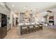 Spacious kitchen with large island, seating, pendant lights, and gray cabinetry at 4324 Auston Way, Palm Harbor, FL 34685