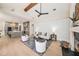 Bright, open living space featuring a modern kitchen, wood beam, and comfortable seating area at 4324 Auston Way, Palm Harbor, FL 34685
