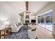 Bright living room with vaulted ceilings, fireplace, and a view of the pool at 4324 Auston Way, Palm Harbor, FL 34685