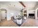 An open-concept living space with kitchen, seating, fireplace, and access to the outdoors at 4324 Auston Way, Palm Harbor, FL 34685