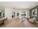 Living room that flows into a dining area, offers a view of the pool, and enhances the home's open feel at 4324 Auston Way, Palm Harbor, FL 34685