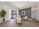 Bright and open living room featuring stylish furnishings and seamless access to the pool area at 4324 Auston Way, Palm Harbor, FL 34685