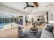 Open-concept living space with pool views, kitchen island, and inviting seating area at 4324 Auston Way, Palm Harbor, FL 34685