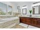 Luxurious bathroom featuring a soaking tub, double vanities, and elegant fixtures at 4907 Bayshore Blvd # 115, Tampa, FL 33611