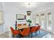 Bright dining area with modern light, stylish art, and comfortable seating for eight guests at 4907 Bayshore Blvd # 115, Tampa, FL 33611