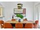 Chic dining area with contemporary lighting, stylish art, and seating for eight guests at 4907 Bayshore Blvd # 115, Tampa, FL 33611