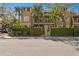 Charming multi-story townhome with lush landscaping and a private gated entrance on a sunny day at 4907 Bayshore Blvd # 115, Tampa, FL 33611