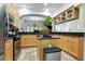 Modern kitchen featuring stainless steel appliances, granite counters, and an island at 4907 Bayshore Blvd # 115, Tampa, FL 33611
