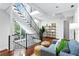 Bright living room with hardwood floors, staircase and modern furnishings in a bright setting at 4907 Bayshore Blvd # 115, Tampa, FL 33611