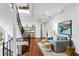 Bright living room with hardwood floors, staircase and modern furnishings in a bright setting at 4907 Bayshore Blvd # 115, Tampa, FL 33611