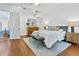 Bright main bedroom with hardwood floors, modern furniture, and ample natural light at 4907 Bayshore Blvd # 115, Tampa, FL 33611