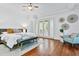 Bright main bedroom with hardwood floors, modern furniture, and ample natural light at 4907 Bayshore Blvd # 115, Tampa, FL 33611