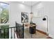 Cozy office space featuring a modern desk, stylish decor, a large window, and carpet on hardwood floors at 4907 Bayshore Blvd # 115, Tampa, FL 33611