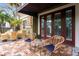 Charming outdoor patio area with brick pavers and cozy seating for relaxing and entertaining at 4907 Bayshore Blvd # 115, Tampa, FL 33611