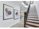 Elegant staircase with wrought iron railing, complemented by modern artwork at 4907 Bayshore Blvd # 115, Tampa, FL 33611