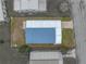 Aerial view of the home highlighting its roof and surrounding yard at 4920 Blanco Dr, Zephyrhills, FL 33541