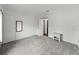 Large empty bedroom with carpet, two closets and an ensuite bathroom at 4920 Blanco Dr, Zephyrhills, FL 33541