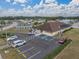 Aerial view of the community clubhouse with ample parking and surrounding neighborhood at 4920 Blanco Dr, Zephyrhills, FL 33541