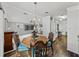 Charming dining room with wooden table, ornate chairs, and elegant chandelier at 4920 Blanco Dr, Zephyrhills, FL 33541