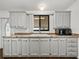 Modern kitchen featuring updated cabinets, stainless steel appliances, and durable countertops at 4920 Blanco Dr, Zephyrhills, FL 33541