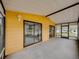 Enclosed lanai featuring sliding glass doors that open into the home at 4920 Blanco Dr, Zephyrhills, FL 33541