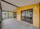 Enclosed lanai with screened windows and sliding glass doors to living area at 4920 Blanco Dr, Zephyrhills, FL 33541