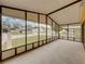 Enclosed lanai featuring large screened windows offering community views at 4920 Blanco Dr, Zephyrhills, FL 33541