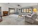 Cozy living room featuring a fireplace, plush carpeting, and modern décor at 4920 Blanco Dr, Zephyrhills, FL 33541