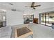 Open-concept living area with fireplace, seamless flow to the kitchen and screened-in porch at 4920 Blanco Dr, Zephyrhills, FL 33541