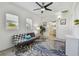 Inviting sunroom with shiplap walls, leafy rug, and natural light from two windows at 5121 15Th S Ave, Gulfport, FL 33707