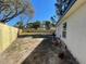 Large backyard with a wood fence offers privacy and plenty of room for outdoor activities at 5751 94Th N Ave, Pinellas Park, FL 33782