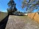Large backyard with wooden fence surrounding the property provides security and privacy at 5751 94Th N Ave, Pinellas Park, FL 33782