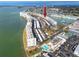Sweeping aerial shot displaying the waterfront condos, covered parking, and community amenities from an elevated perspective at 6025 Shore S Blvd # 410, Gulfport, FL 33707