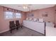 Clean laundry room with multiple washing machines, natural light, and seating area at 6025 Shore S Blvd # 410, Gulfport, FL 33707