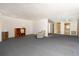 Wide open living room space with carpeting, offering a bright and airy atmosphere at 6025 Shore S Blvd # 410, Gulfport, FL 33707