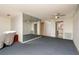 Spacious living room with ceiling fan and direct access to the kitchen at 6025 Shore S Blvd # 410, Gulfport, FL 33707
