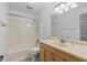 Clean bathroom features a shower and tub combination and a vanity with a sink at 6337 S Lansdale Cir, Tampa, FL 33616