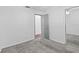 Bedroom with neutral carpet and a mirrored closet, enhancing space and light at 6337 S Lansdale Cir, Tampa, FL 33616