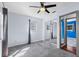 Carpeted bedroom with mirrored closet doors and a large window with outdoor views at 6337 S Lansdale Cir, Tampa, FL 33616