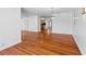 Open-concept living room featuring hardwood floors, seamlessly connecting to the kitchen with modern appliances at 6337 S Lansdale Cir, Tampa, FL 33616