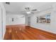 Spacious living room featuring hardwood floors, ample natural light, and modern ceiling fan at 6337 S Lansdale Cir, Tampa, FL 33616