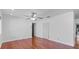 Living room with hardwood floors, freshly painted and a ceiling fan at 6337 S Lansdale Cir, Tampa, FL 33616