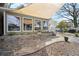 Charming patio featuring stone accents, and canvas for shade for year-round enjoyment at 6835 S Shamrock St, Tampa, FL 33616