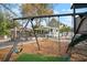 Spacious backyard with playground, outdoor seating, dining area, and cozy lounge space at 6835 S Shamrock St, Tampa, FL 33616
