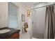 Updated bathroom with a tiled shower, modern fixtures, and a classic vanity at 6835 S Shamrock St, Tampa, FL 33616