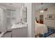 Bathroom featuring white marble countertops, a glass shower, and views into the Primary bedroom at 6835 S Shamrock St, Tampa, FL 33616